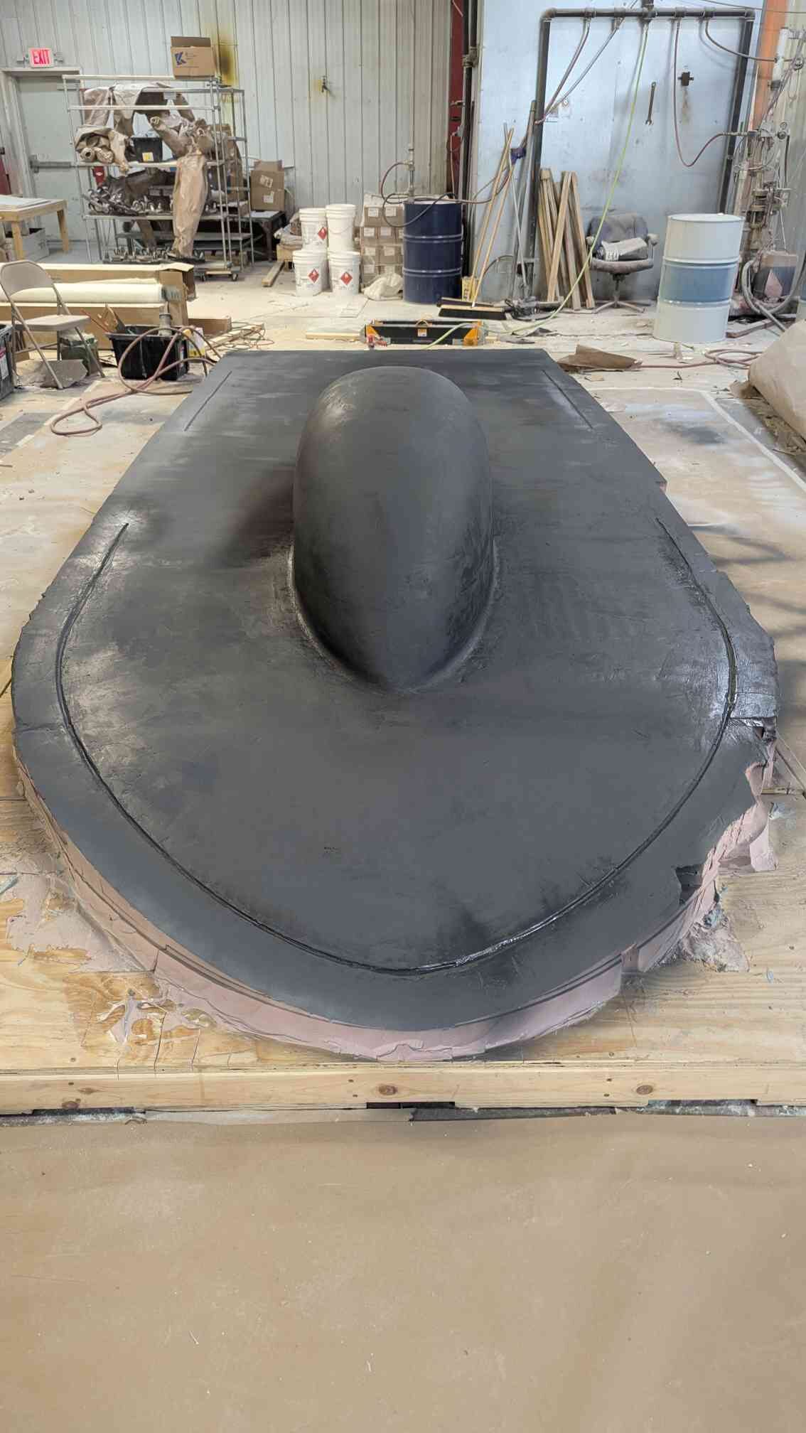 Top shell plug with canopy bump in black surfacing primer