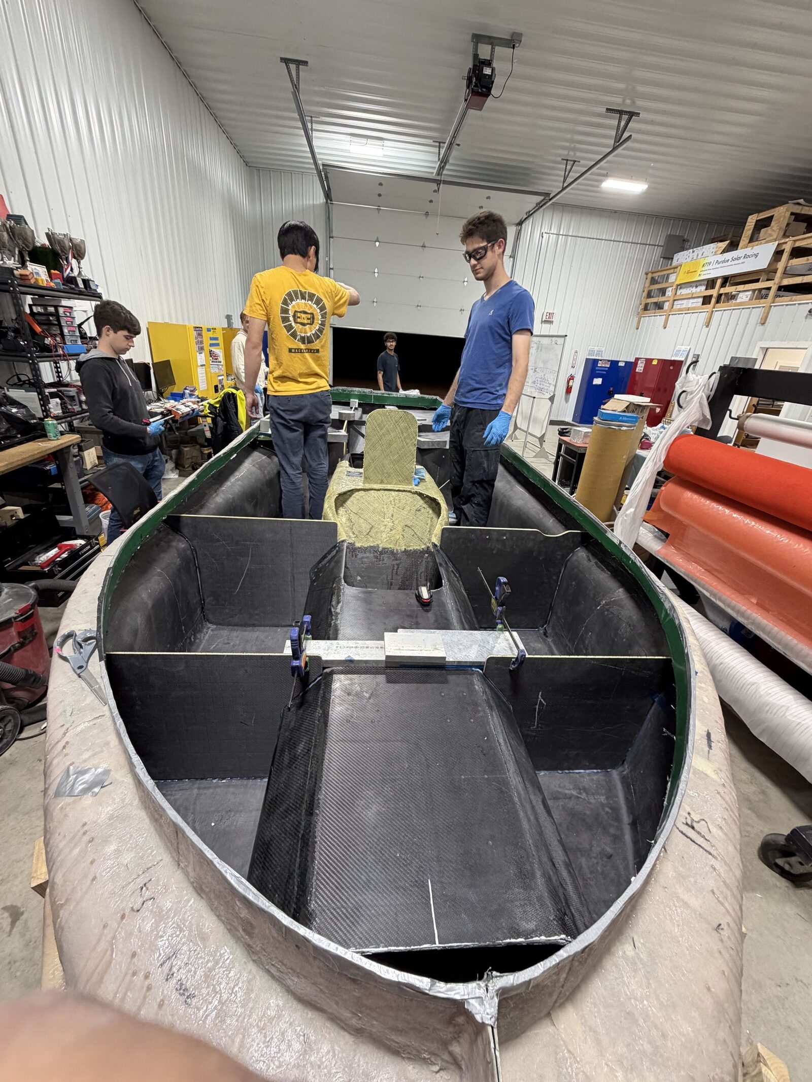 Bonding and clamping internal supports inside the carbon shell