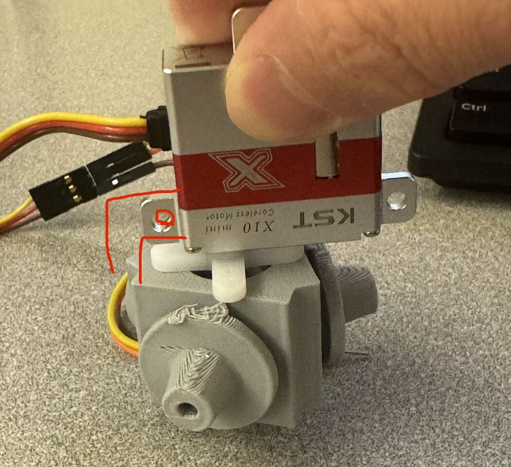 The rejected KST X10 servo mounted on the connector body it forced a redesign of