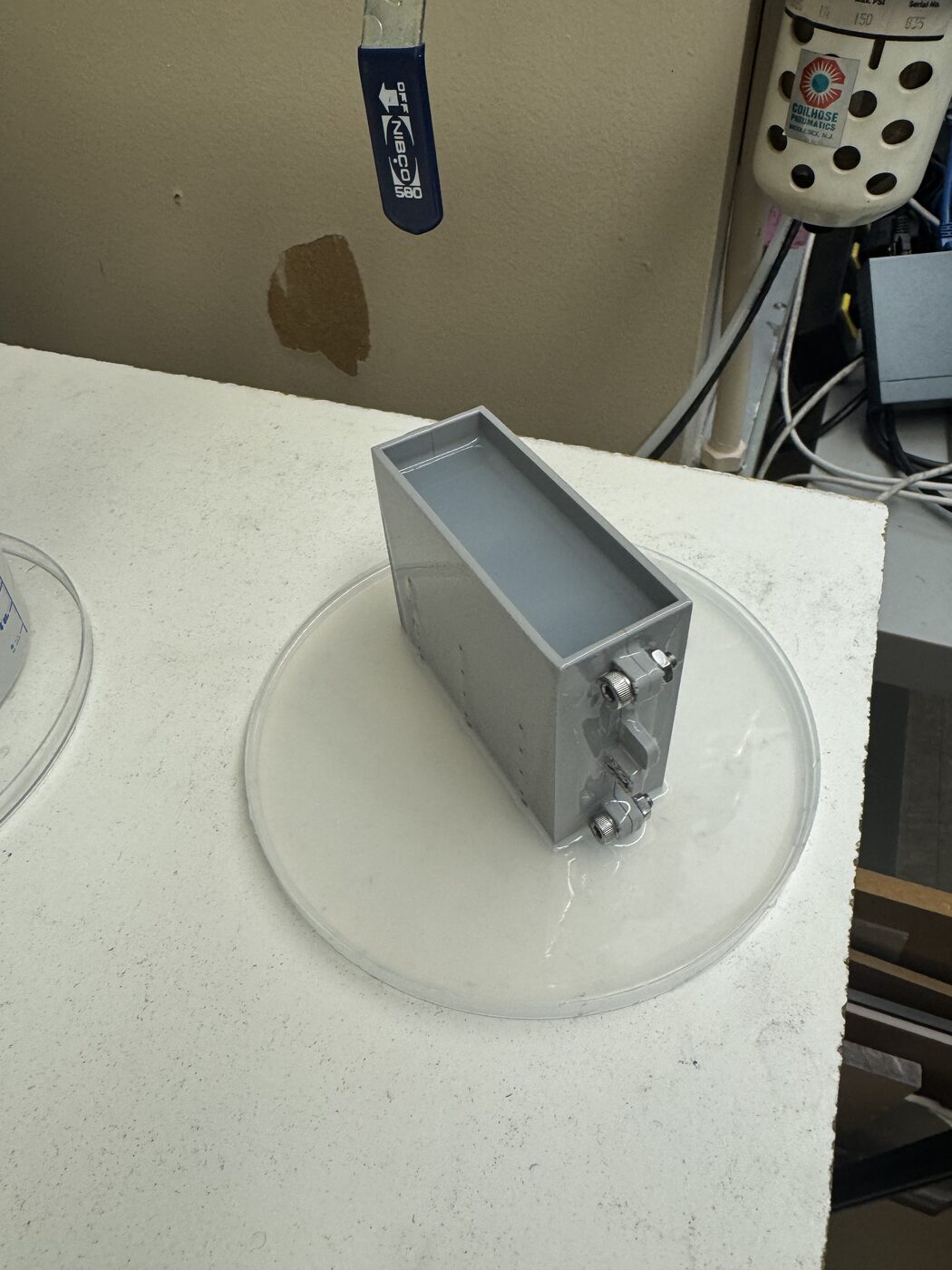 Silicone mold sitting on the vacuum chamber shelf during degassing