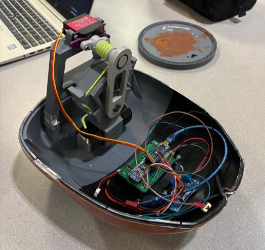 Inside the sea lion: capstan drive and wired protoboard in the bottom shell